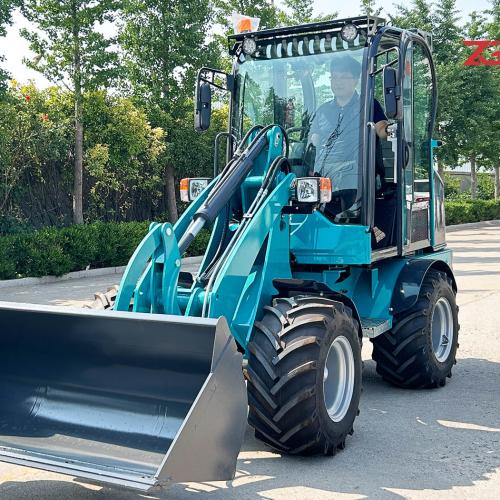 What is the difference between a wheel loader and a track loader?