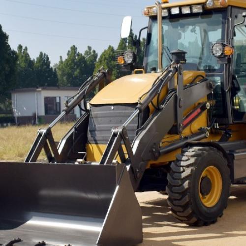 What is a backhoe loader used for, and what are its main functions?