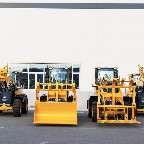 What attachments are most useful for a wheel loader on a farm?
